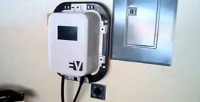 Electric car charger installation with wall-mounted EV charging station in Olathe, KS