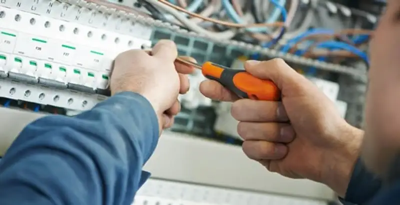 electrical service showing licensed electrician performing electrical panel maintenance and adjustments in Olathe, KS