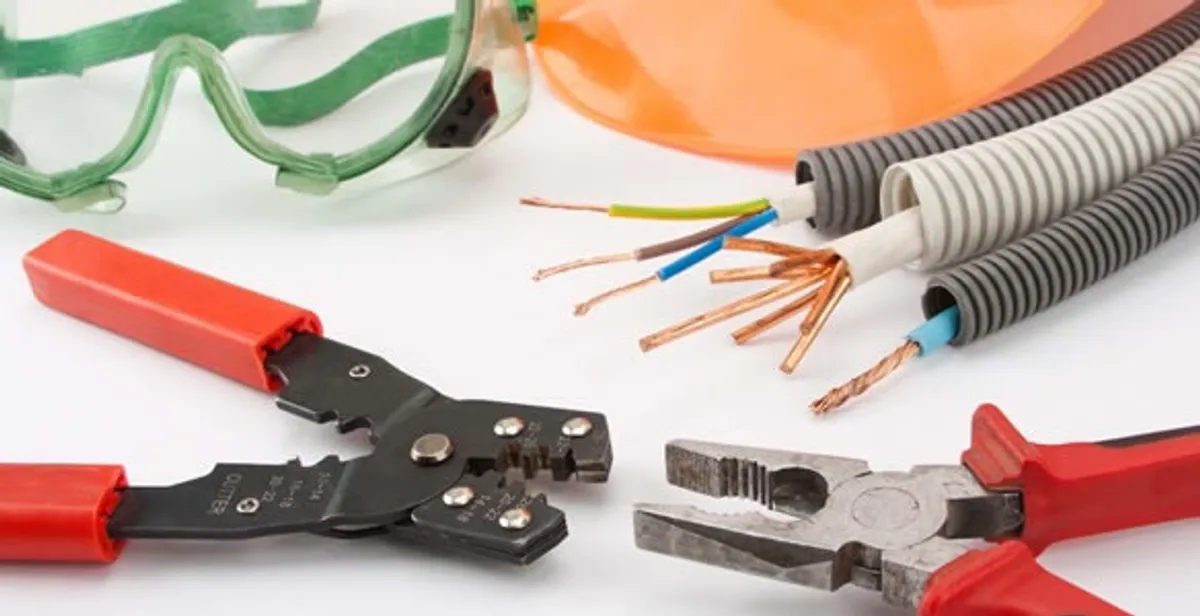 Electrical wiring repair with professional tools and safety equipment in Overland Park, KS