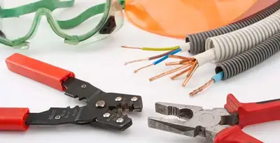 Electrical wiring repair with professional tools and safety equipment in Shawnee Mission, KS