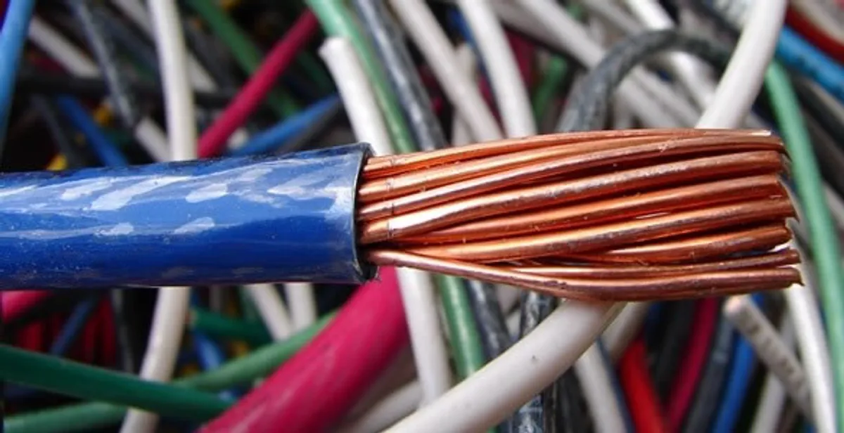 electrical wiring services showing exposed copper conductors and cable preparation in Olathe, KS