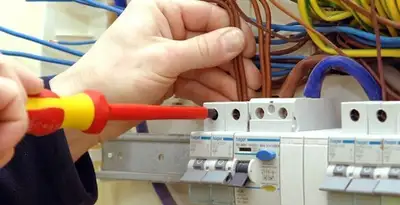electrician services performing professional electrical panel wiring and connections in Olathe, KS