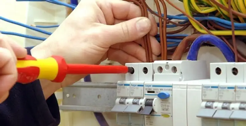 electrician services performing professional electrical panel wiring and connections in Olathe, KS