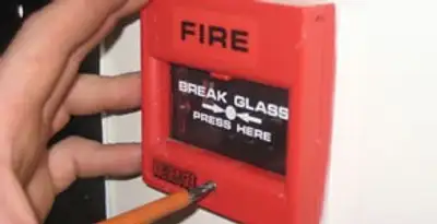 fire alarm installation service showing manual fire alarm pull station installed by licensed electricians in Olathe, KS