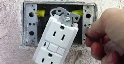 gfci circuits service showing installation of a ground fault circuit interrupter outlet by licensed electricians in Olathe, KS