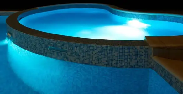 pool light installation and repair services highlighting illuminated pool interior lighting in Olathe, KS
