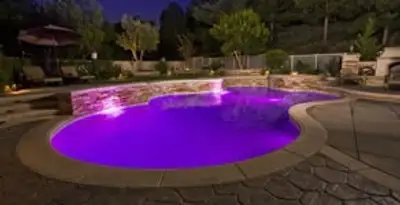 pool light installation and repair services illuminating a residential swimming pool in Olathe, KS