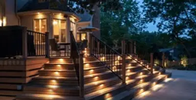 Residential electrician installing outdoor lighting for home safety in Olathe, KS