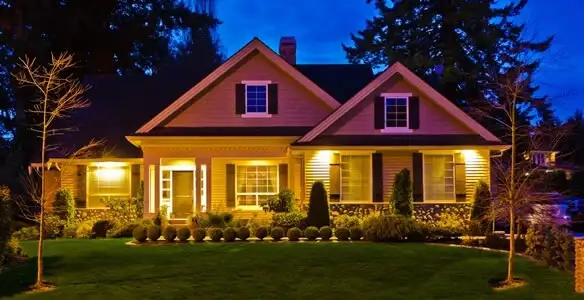 security light installation services illuminating a residential exterior at night in Olathe, KS