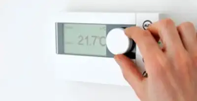 Thermostat installation service with professional adjusting temperature control in Olathe, KS