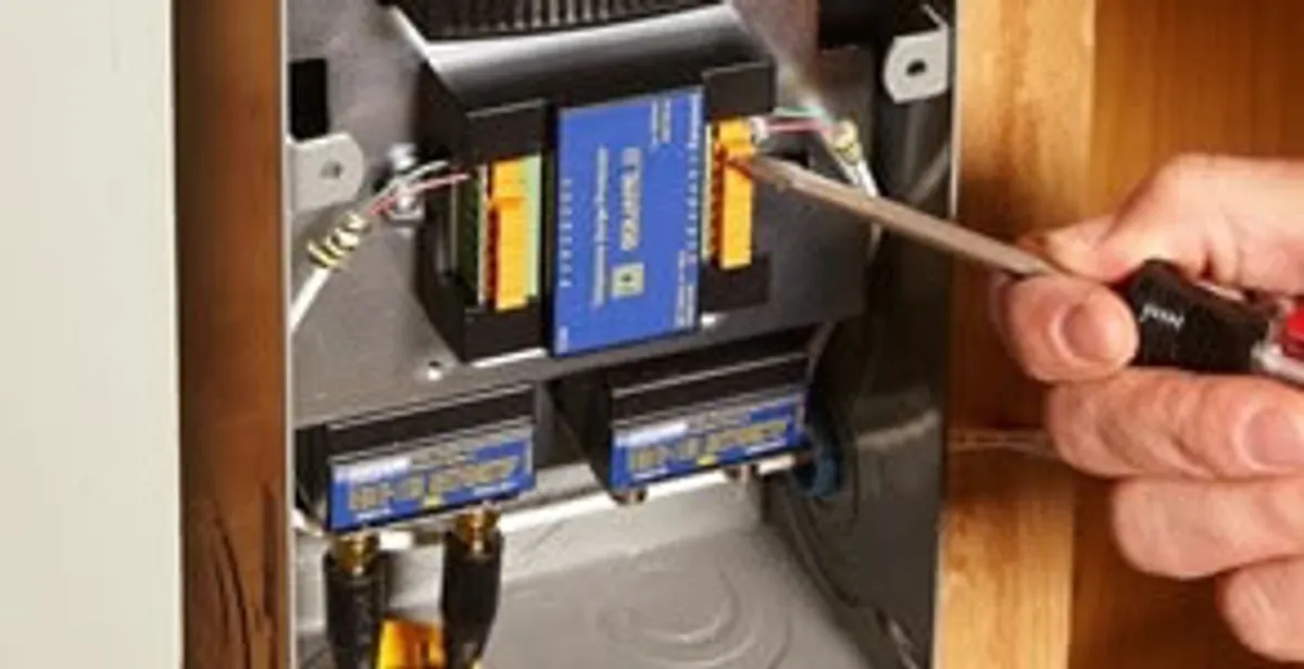 Whole home surge protection device being installed by a licensed electrician to protect electrical systems in Olathe, KS